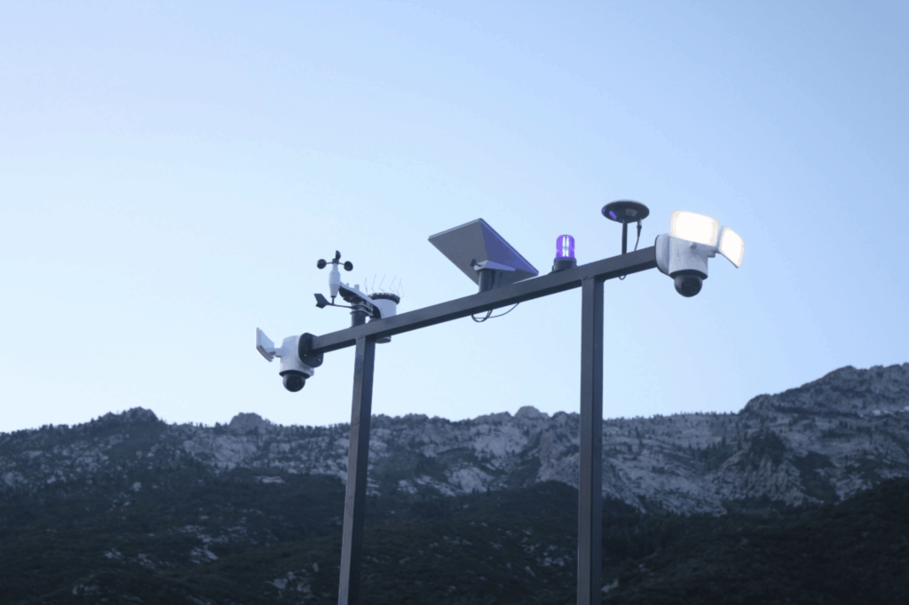 Construction site CCTV camera trailer providing 24/7 surveillance of an active job site at night