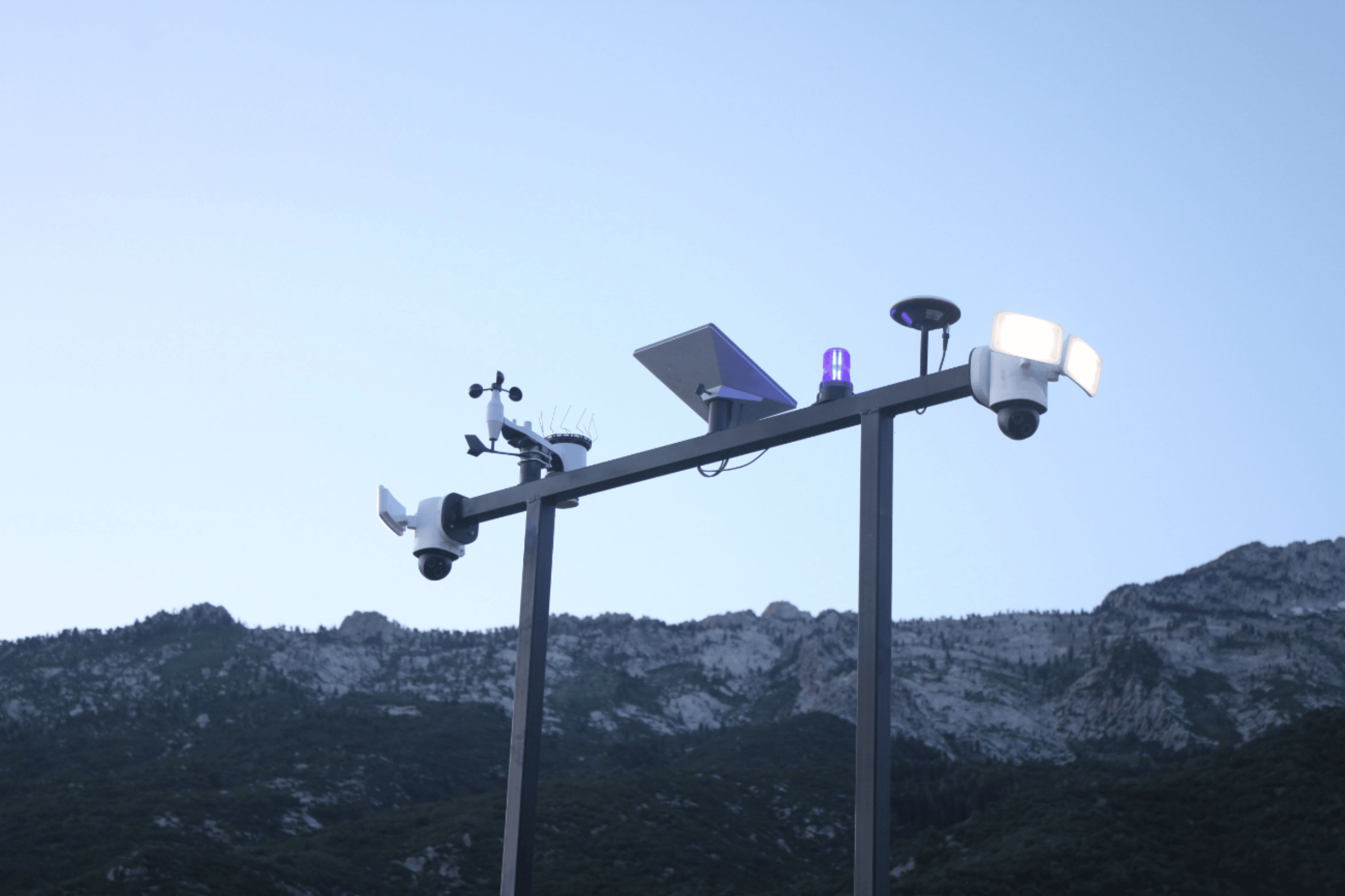 Construction site CCTV camera trailer providing 24/7 surveillance of an active job site at night